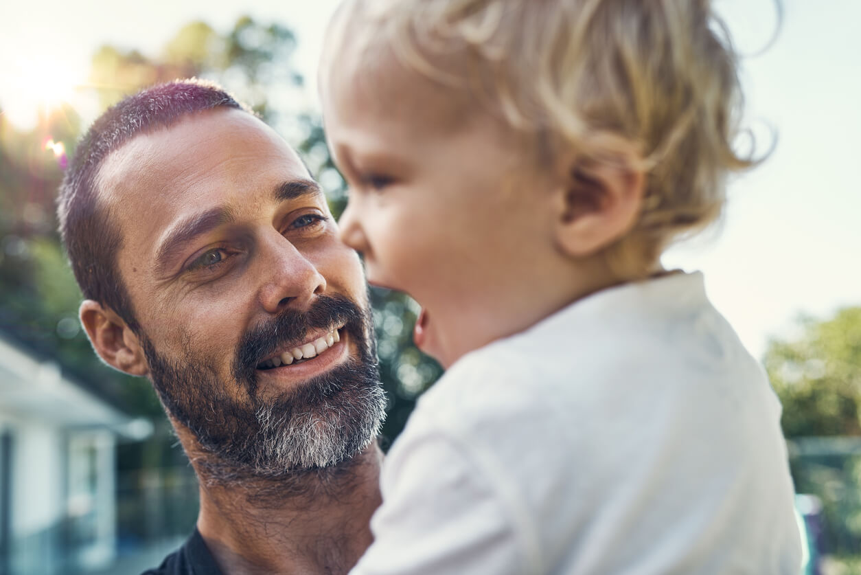 An image of a children with his father who is fighting a child custody case with a child custody attorney.