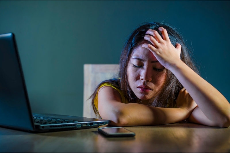 An image of a depressed women looking to speak to a family court lawyer to get legal assistance.