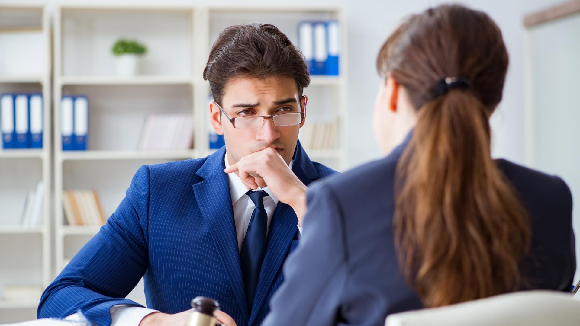 An image of a lawyer discussing sexual offences made to their client.